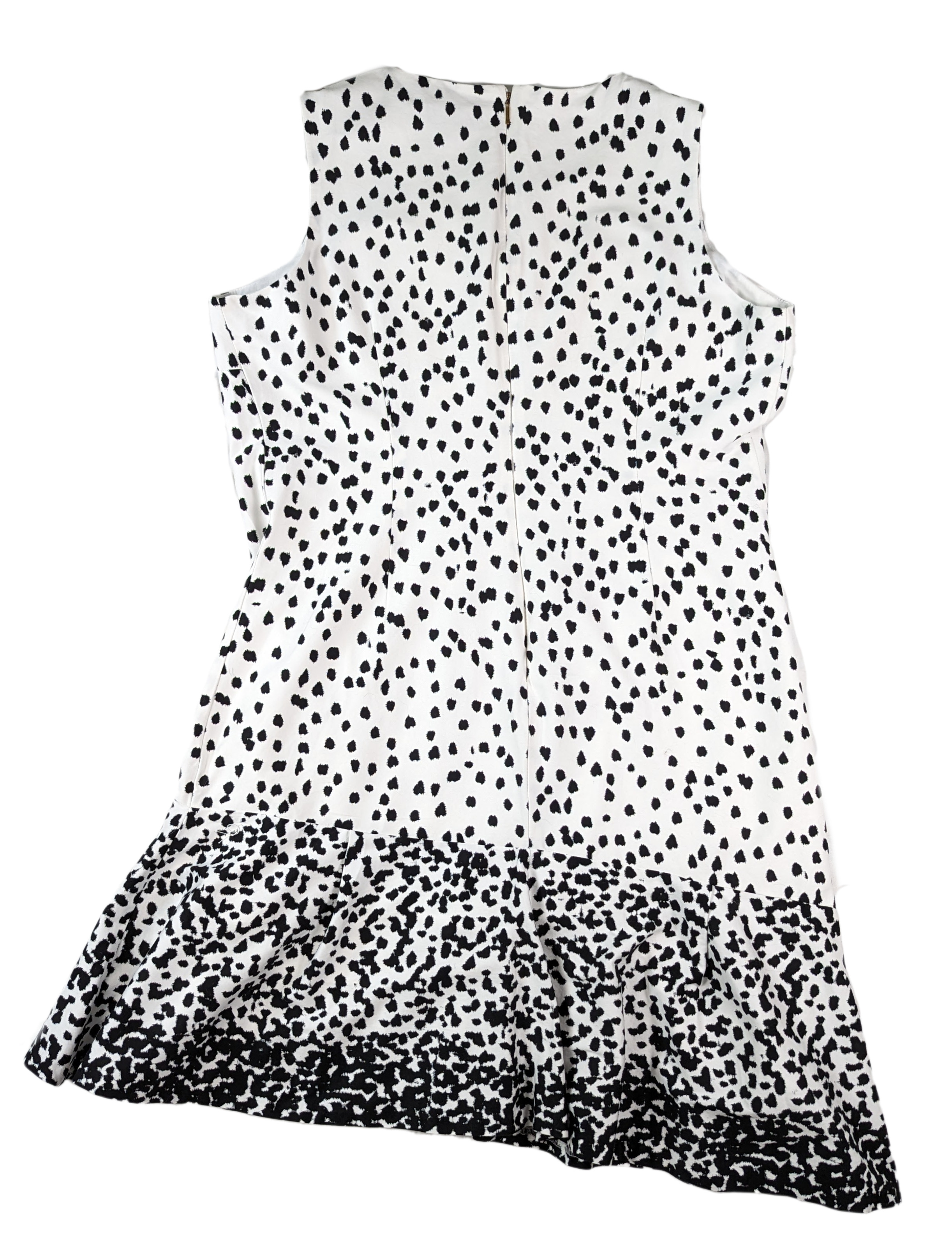 Donna Karan Sleeveless Black and White Dress with Polka Dots and Asymmetrical Hem.sA painterly Dalmatian dot print patterns this sleeveless dress, with an ombré dot finish and asymmetric hemline adding flair to the silhouette. Round neck,  sleeveleDonna Karan White DressDresses