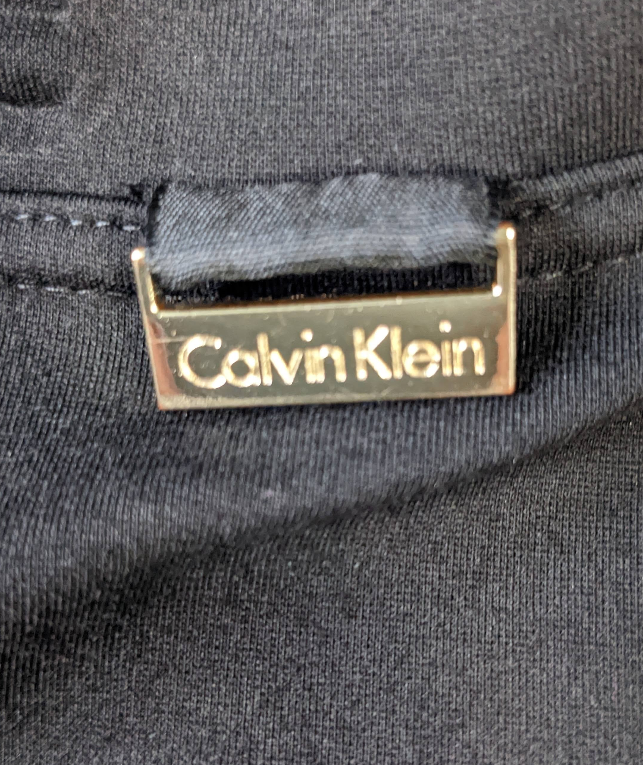 Calvin Klein Black Knit Power Stretch PantsThese wear like a legging (super comfy) but look like a crop pant (super stylish).  Wear them dressy or casual.