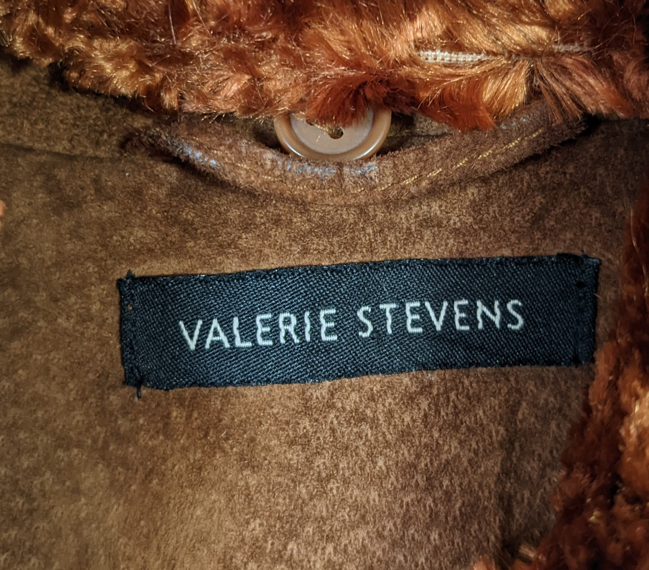 Valerie Stevens Rusty Brown Leather JacketThe color of this jacket is perfect for fall, and it has a removable faux fur collar.  It looks great either way!  Zip front with two slit pockets, soft suede.