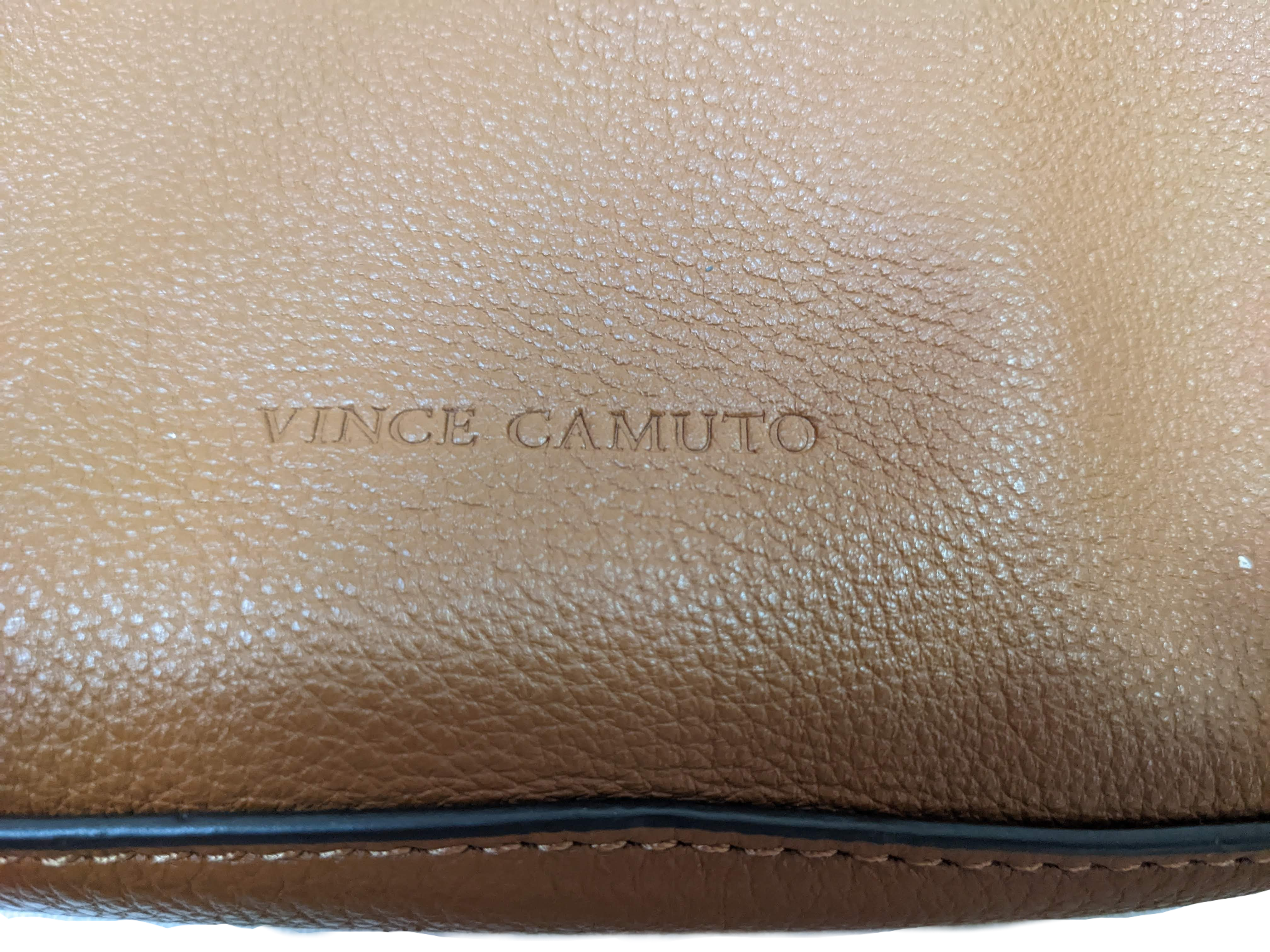 Vince Camuto Tan Leather Crossbody bag  Perfect everyday handbag!   Lots of pockets to stash all your things, and an adjustable strap for shoulder or crossbody use!