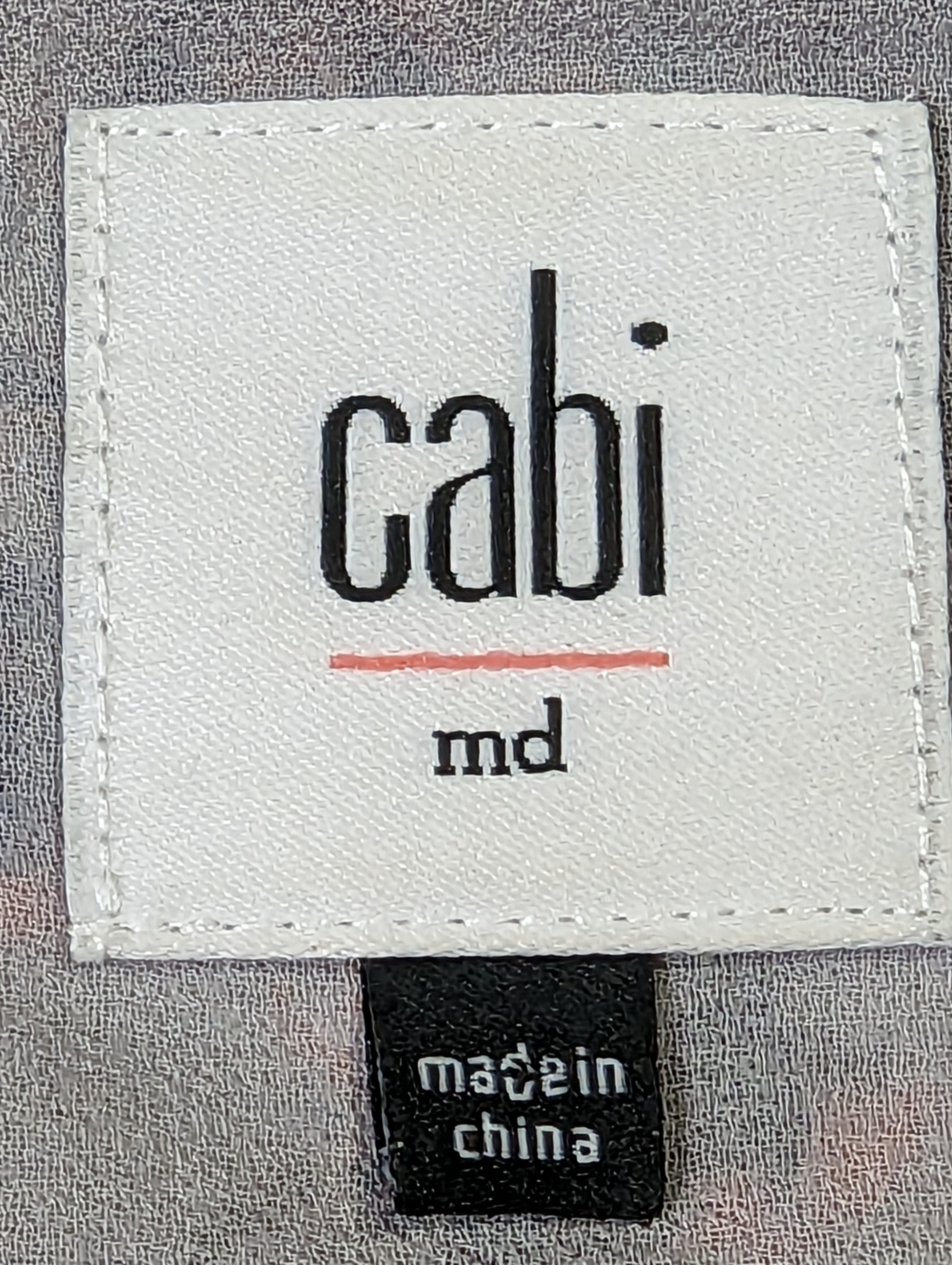 CAbi Strappy Print Dress Size M Elevate your wardrobe with the CAbi Strappy Print Dress. This size Medium dress features a unique grey, blue, white, and orange print