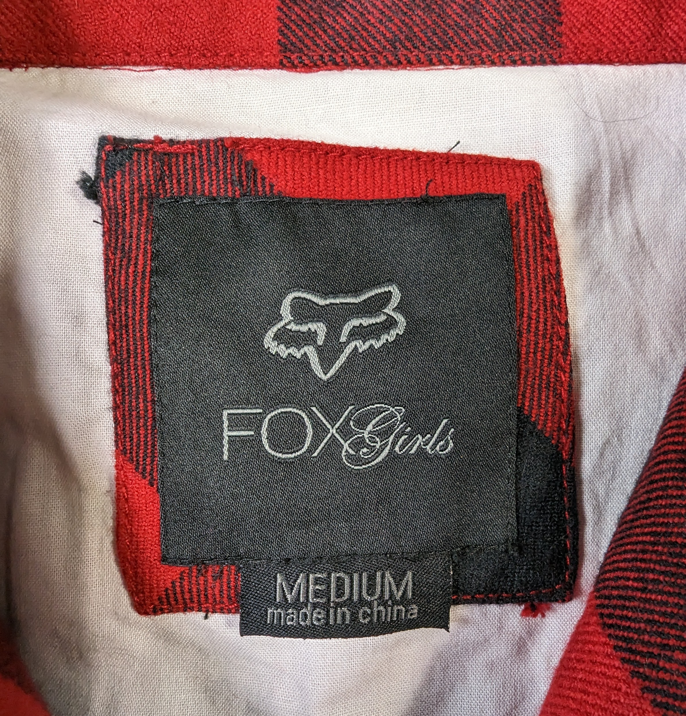 Fox Girls Black and Red Plaid Jacket Size Medium   Rock the streets in style with the Fox Girls Black and Red Plaid Jacket. This medium-sized jacket features a faux 