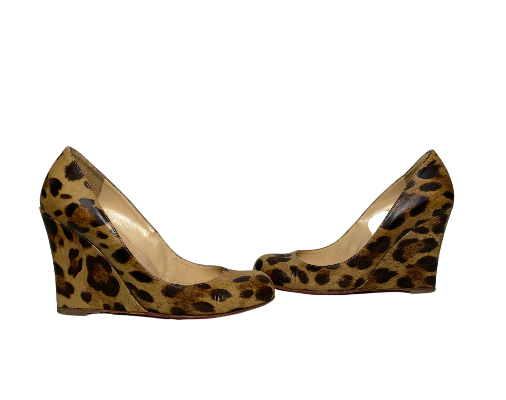 These Christian Louboutin Leopard Print Patent Leather Wedges are worn, but still look amazing!! The bottom shows most of the wear. Box and cloth bag included.
The i