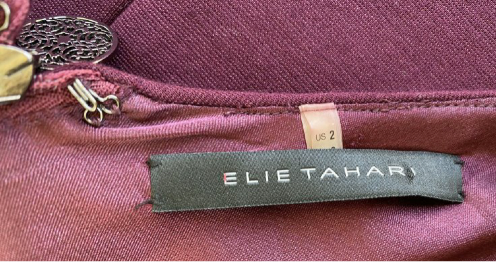 Elie Tahari Plum Sleeveless Dress with Ruching in the front. Embrace t