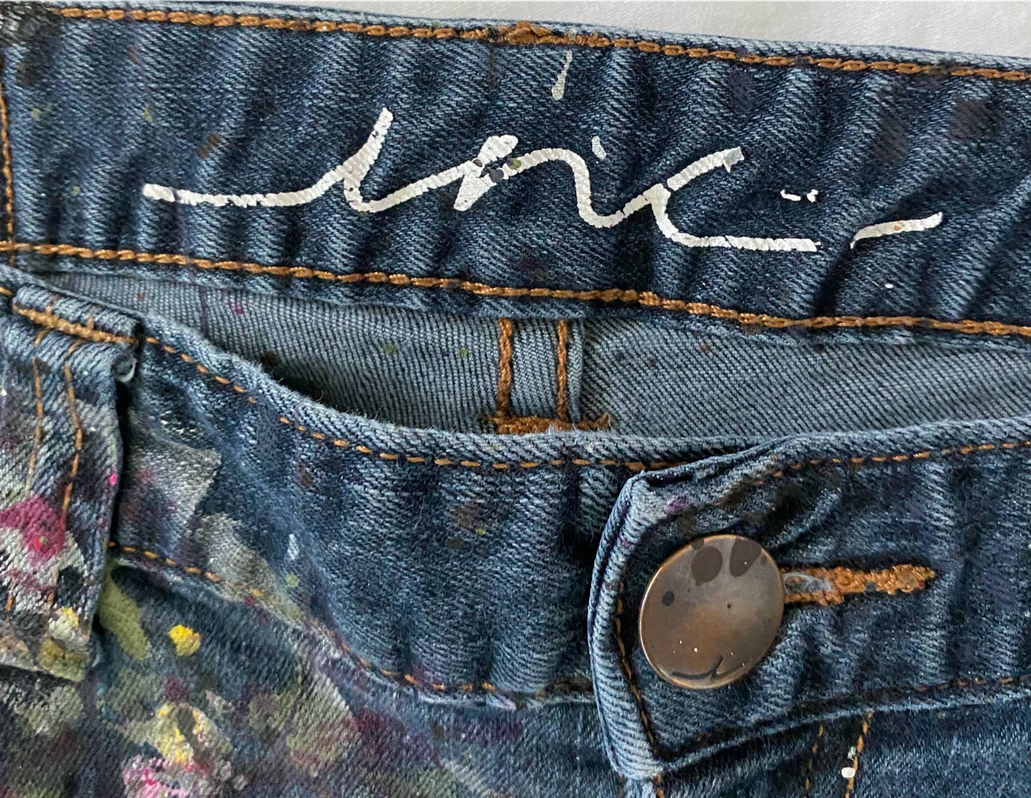 REFRESHED - INC Hand Painted Dark Denim Jeans Size 12 Get ready to make a statement with these REFRESHED dark denim jeans from INC. Featuring a slight flare leg and