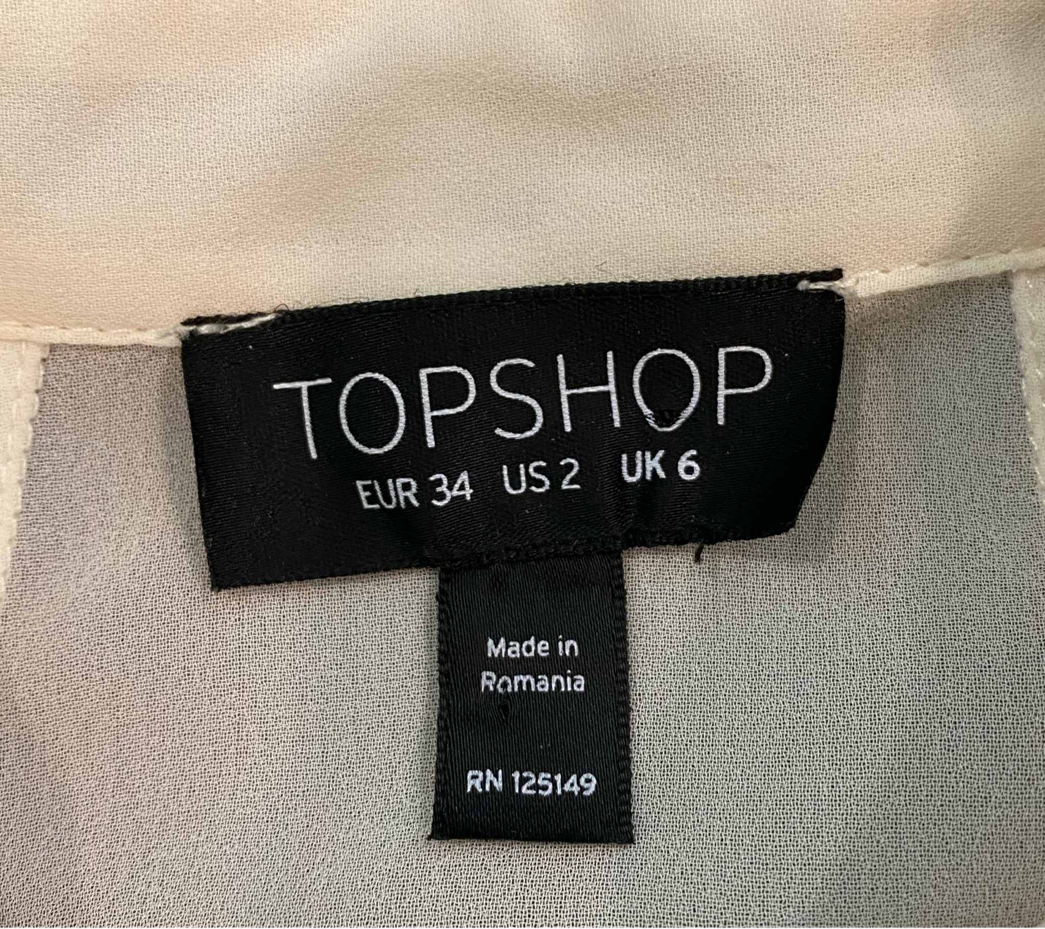 Topshop Sheer Cream Blouse Topshop cream long sleeve sheer blouse with front and back panels.