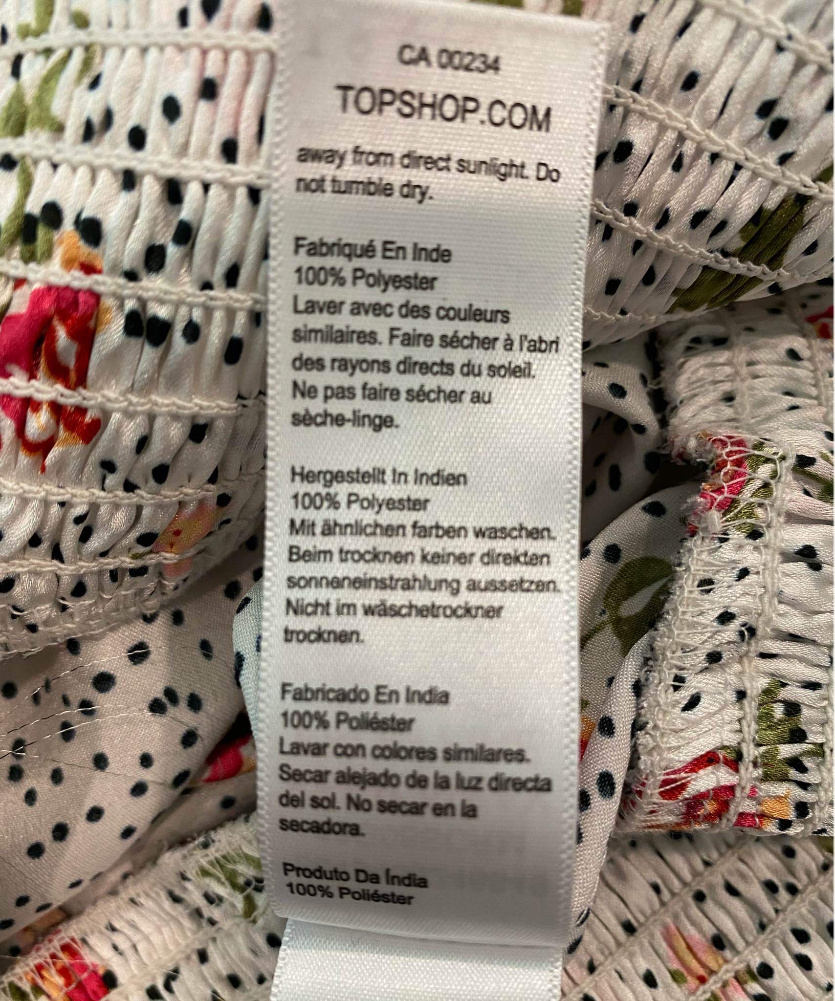 Topshop White Printed Silky BlouseTopshop long full sleeve silky printed blouse with button front and tie at elastic band waist.
 