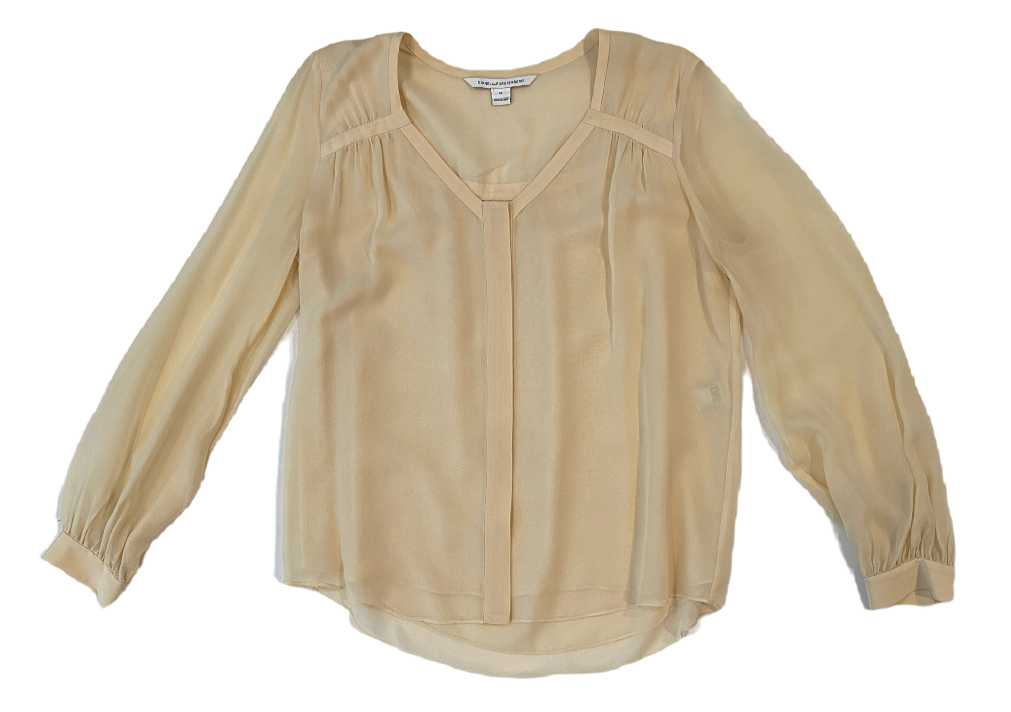 Diane Von Furstenberg Long Sleeve Silk Cream BlouseDVF sheer silk lined cream blouse with long sleeves and band detail at neck line. Hidden button front and button cuffs. 
This timeless blouse can easily be dressed u