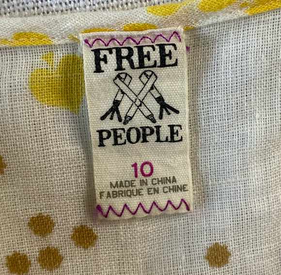 Free People Linen Button-down Strappy TankSuch a great tank!  It has it all - ruffles, buttons, and adjustable straps! Plus, a cute floral print!