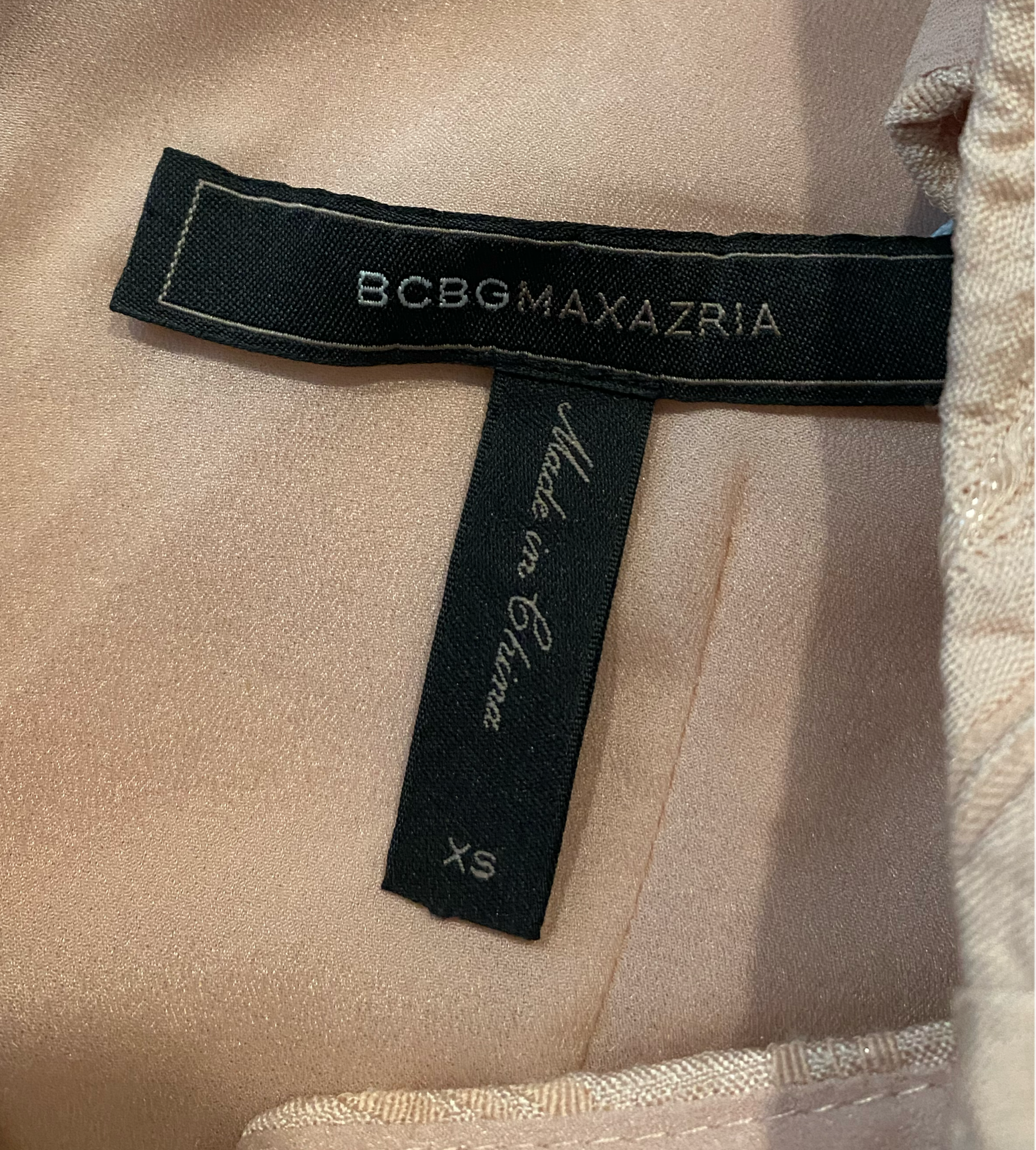 BCBG Maxazria Sleeveless Blush Jacquard Dress  Exude elegance and sophistication in the BCBG Maxazria Sleeveless Blush Jacquard Dress. The intricate blush jacquard d