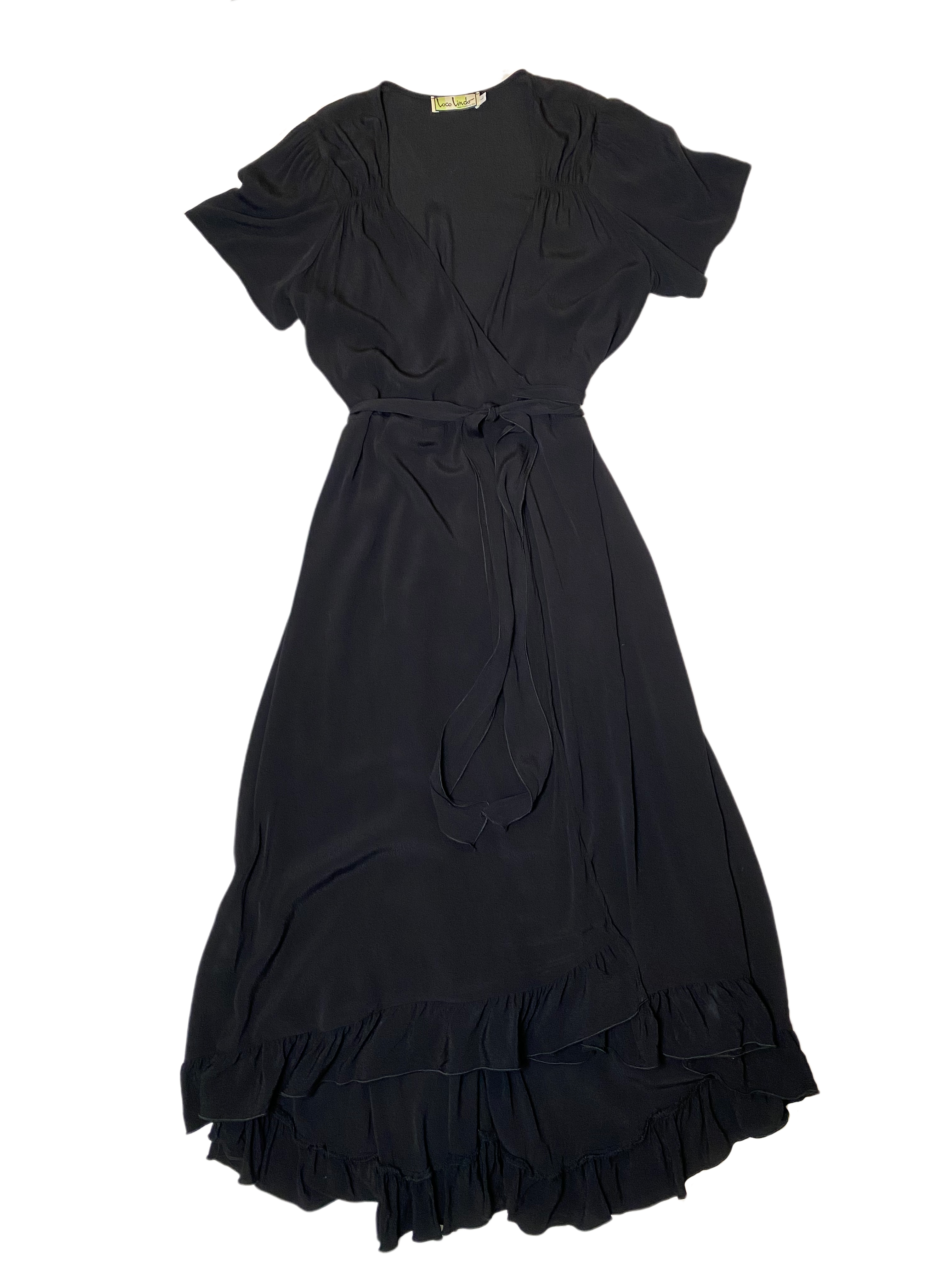 Loco Lindo Long Black Wrap Dress with RuffleThis elevated classic black wrap dress has added gathering at the neck line, short sleeves and a slight high-low ruffled hem line for a beautiful feminine look.Loco Lindo Long Black Wrap Dressdress