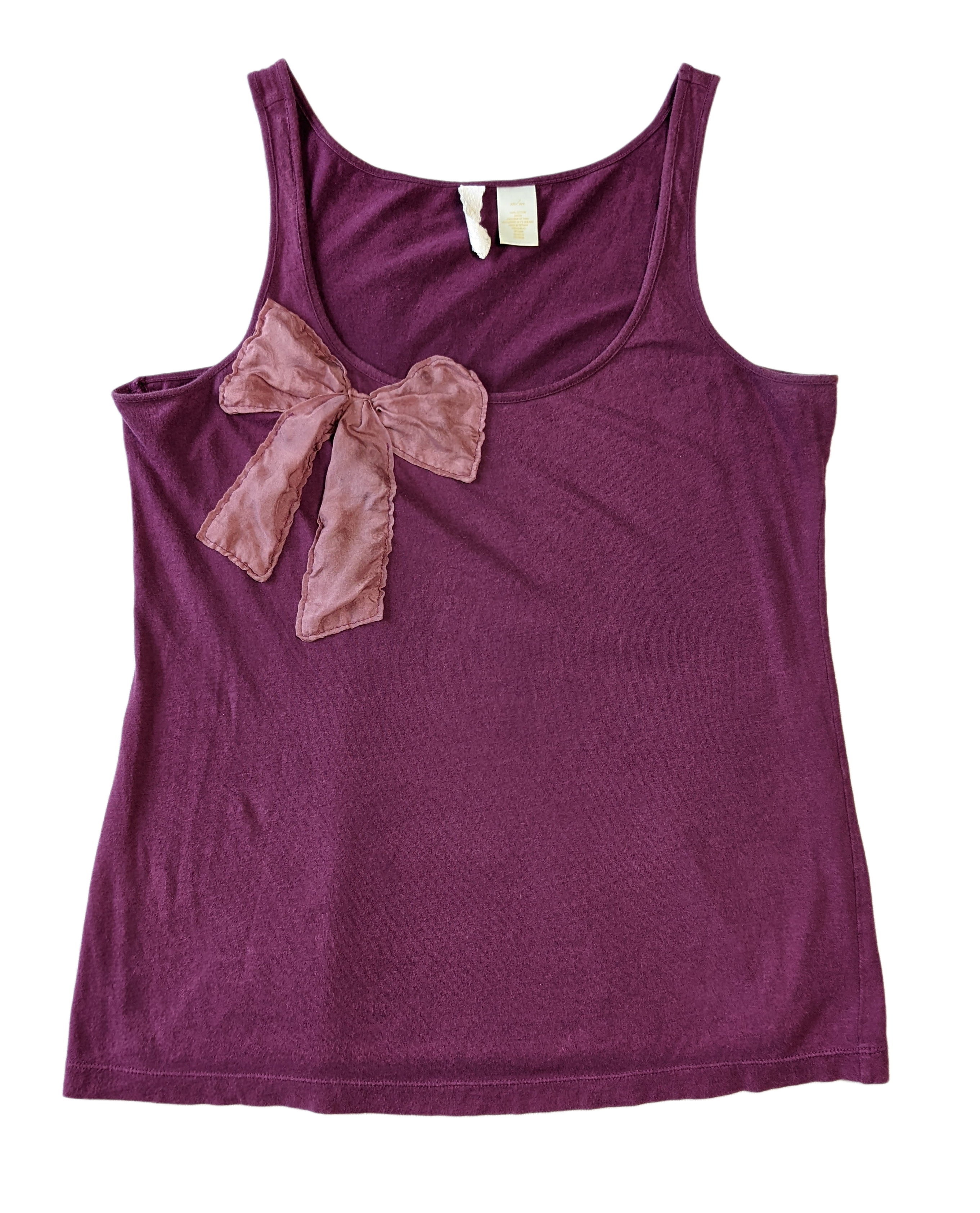 Eloise By Anthropologie Magenta Tank With Pink Bow detail Unleash your playful side in the Eloise tank by Anthropologie! This tank features a vibrant magenta color an