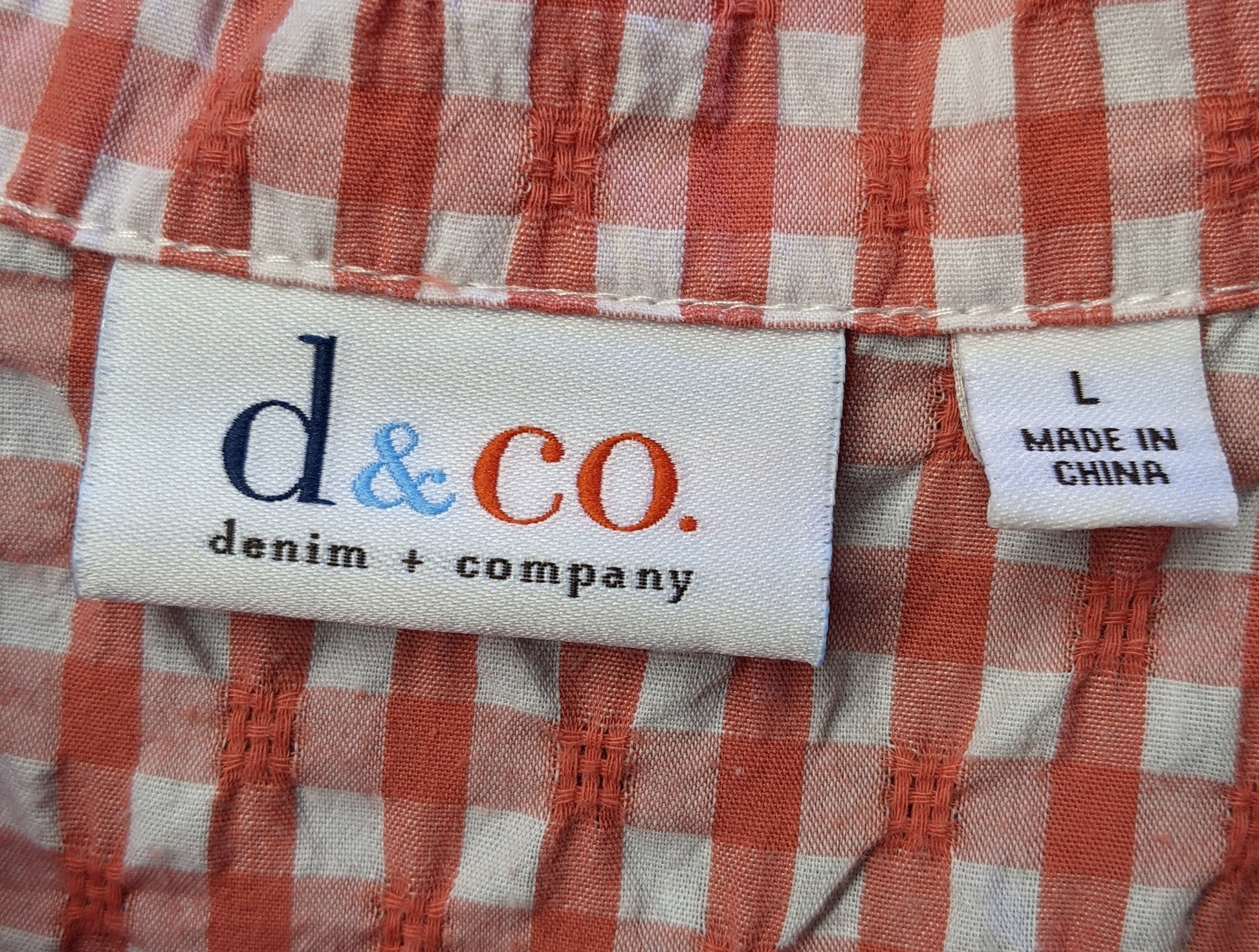 d & Co Orange Gingham Blouse with Ruffled Hem and CuffsSuch a cute and flirty blouse, with ruffle details at the hem and cuffs. And the orange gingham is perfect for a day out!
 