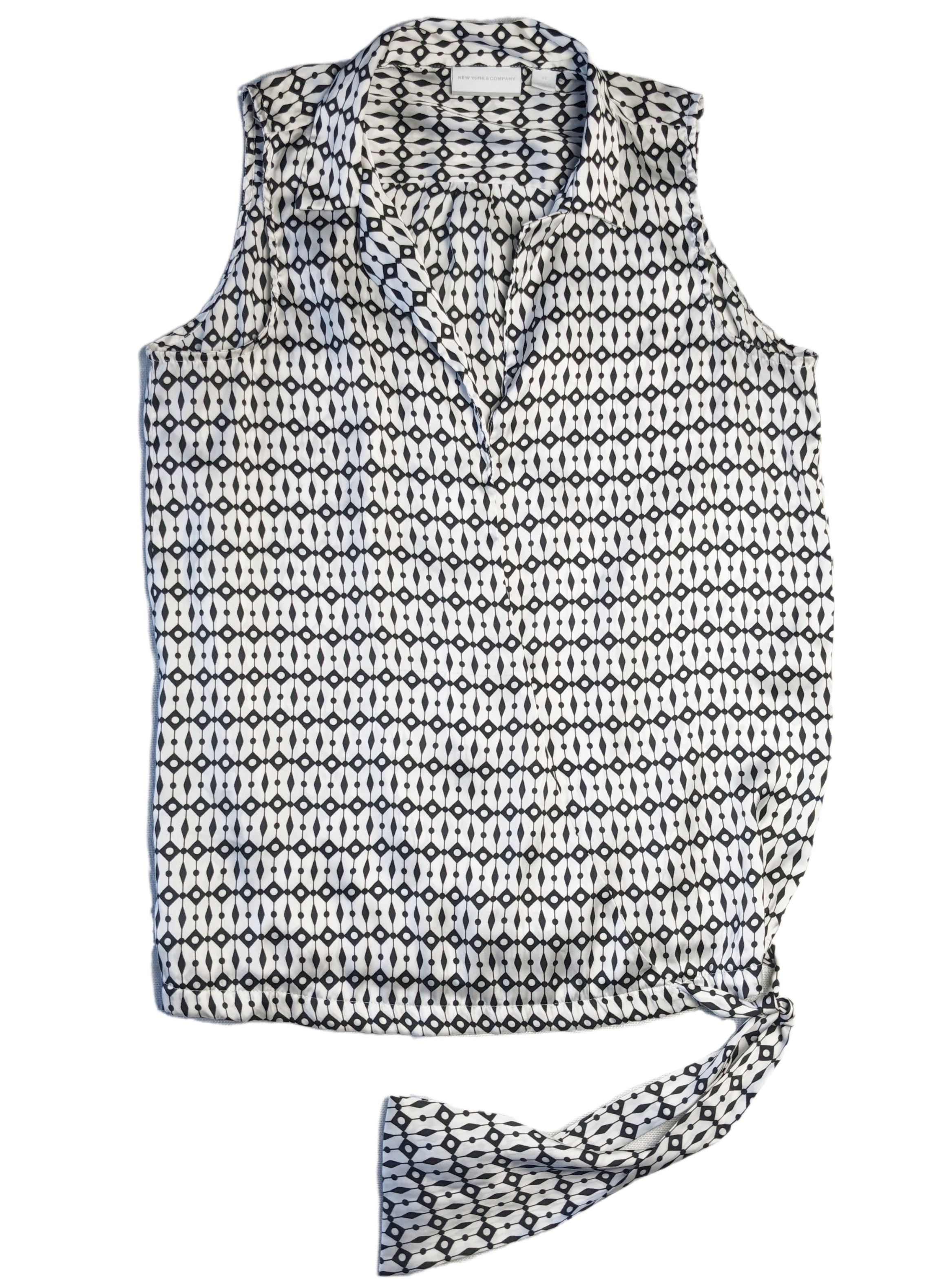 New York & Co Black and White Sleeveless Blouse This is a great top to dress down with jeans, or dress up with black slacks.  Or try a pop of color and wear with a g