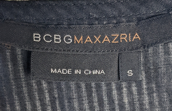 BCBG Maxazria Sleeveless Ruffled Sheer Top Gorgeous sheer top to dress us your wardrobe.  Perfect for date night or a night out with the girls!