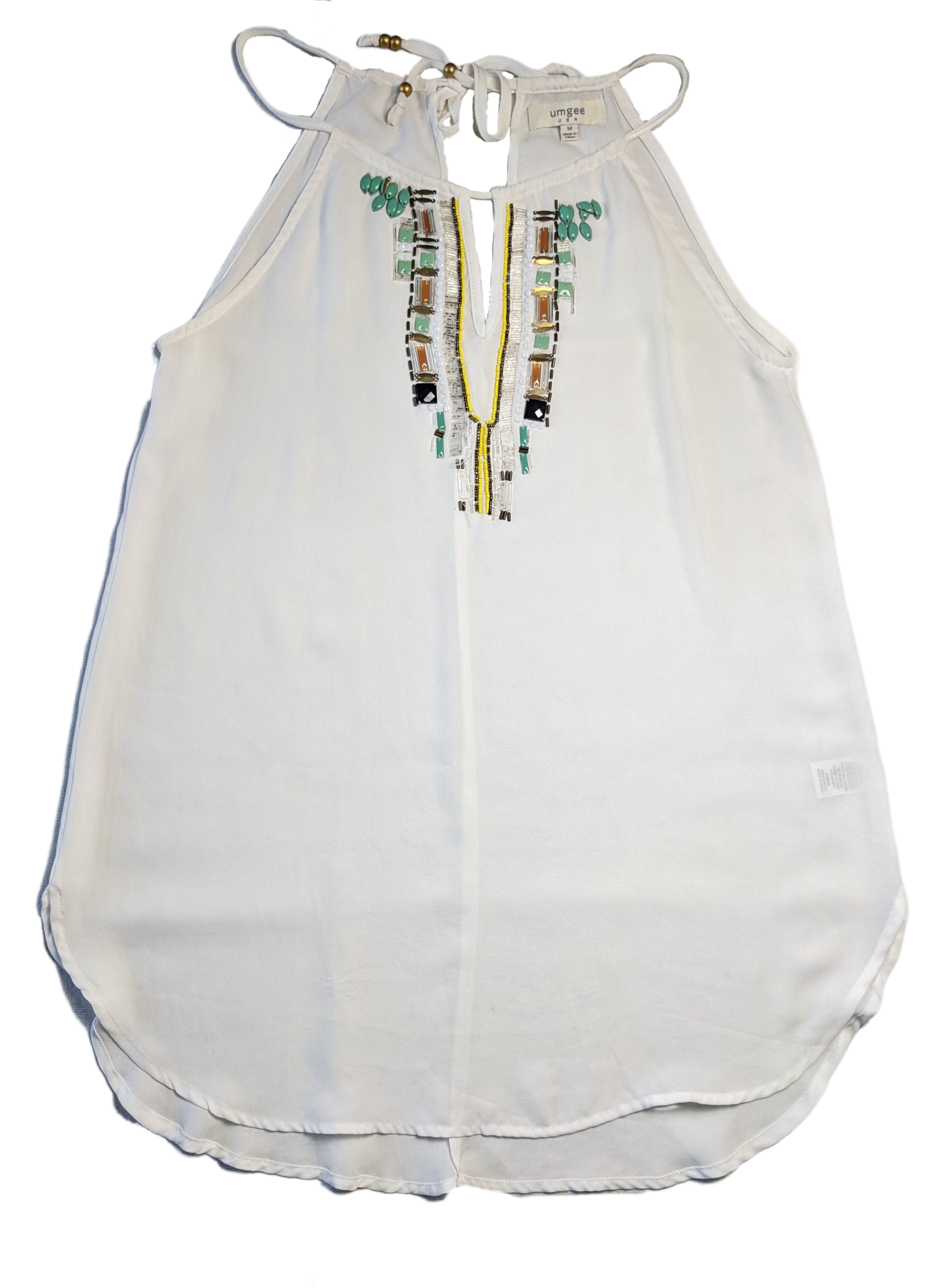 Umgee Halter Top with BeadingThis piece is so versatile, and it adds a little interest to your outfit, too!  You can wear this in warmer weather (or on a winter vacay!) with shorts and sandals, 