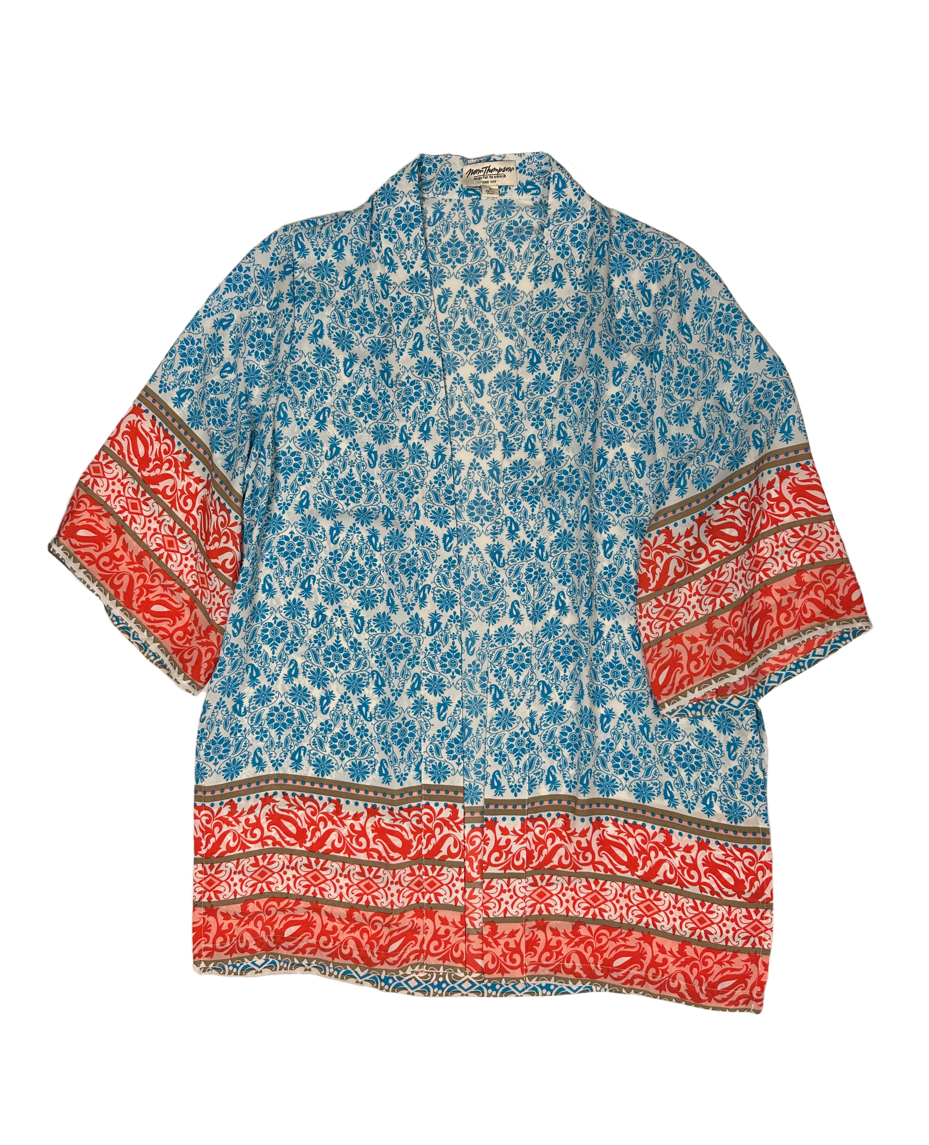 Norm Thompson Short Sleeve Printed KimonoWrap yourself up in sunny vibes with this Norm Thompson short sleeve printed kimono! Feel free to flaunt your style with the bright colors and printed pattern, breezNorm Thompson Short Sleeve Printed KimonoTops