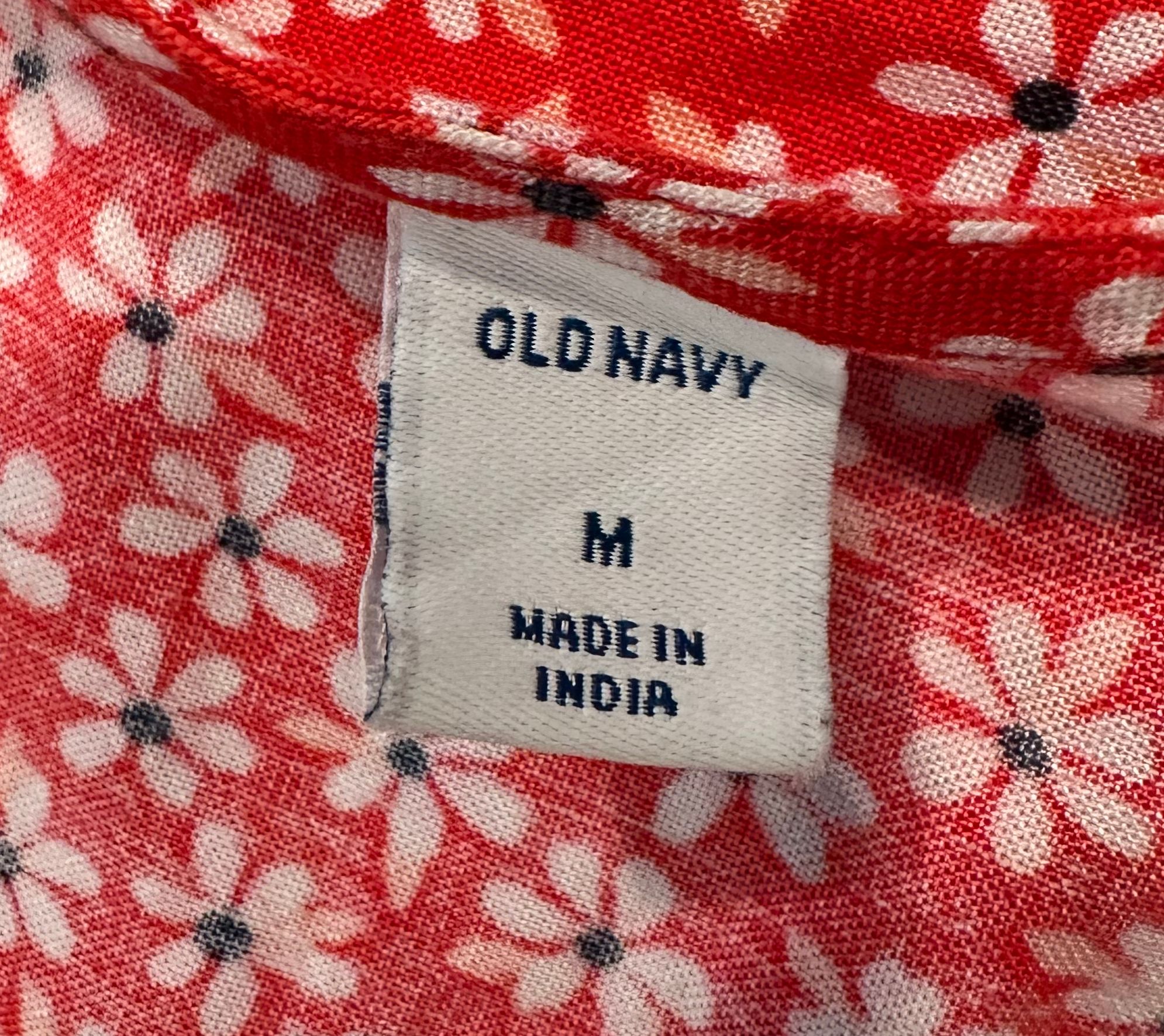 Old Navy Red Floral Print Wrap Shirt with Flutter SleevesThis cute flutter sleeve wrap top is a great way to add a pop of color and interest to a basic pair of jeans or a wide leg pant. Add a strappy sandal and you are reaNavy Red Floral Print Wrap ShirtShirt