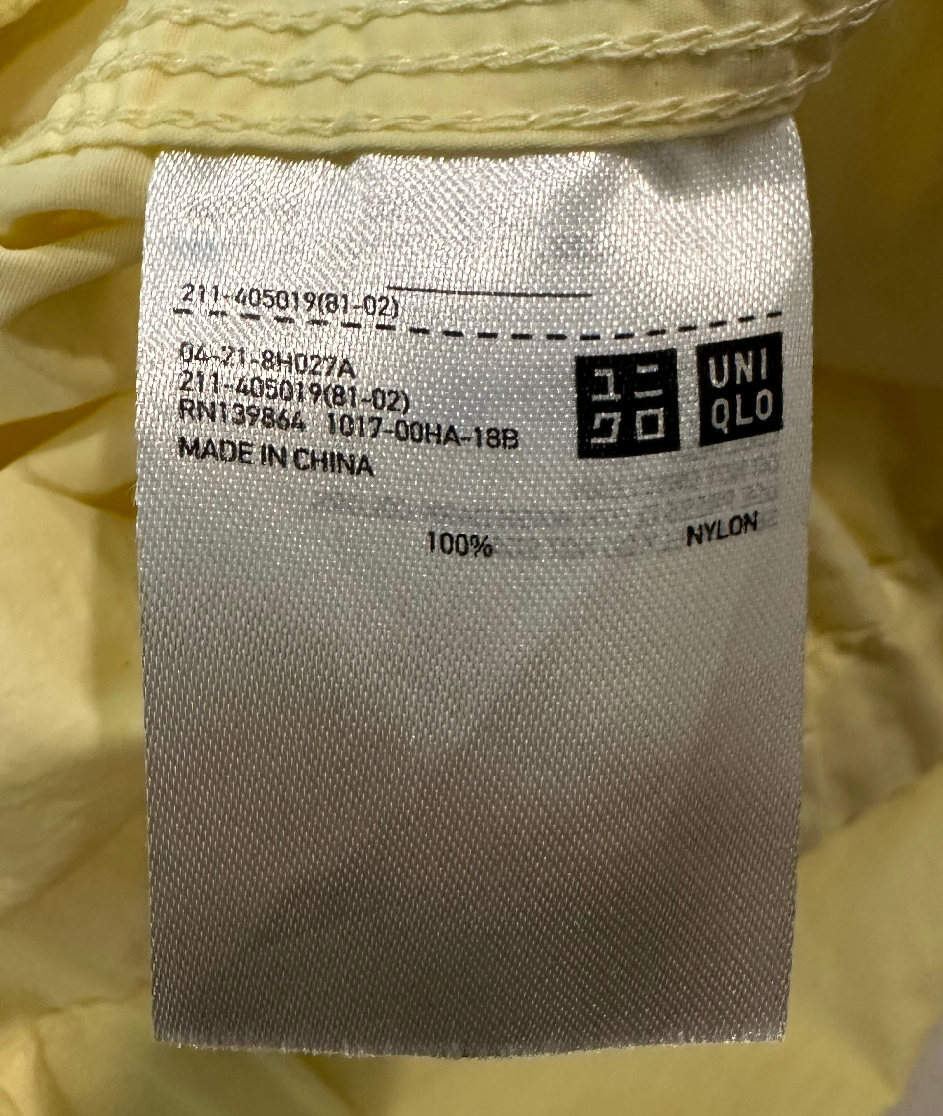 Uniqlo Yellow Windbreaker with Hood in CollarThis is so light weight, it's great for packing or tossing in your purse for a day out. Wear with or with out the easy to roll away hood.Uniqlo Yellow WindbreakerCoats & Jackets